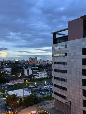 a view of a city with a tall building at MoonStay C1 Impact Arena Muangthongthani-Donmuang-FreeSpeedWifi in Nonthaburi