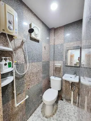 a bathroom with a toilet and a sink at Cozy Private Family Apartment in Bangkok CBD Silom-Sathorn - 240m to BTS Saint Louis in Yan Nawa