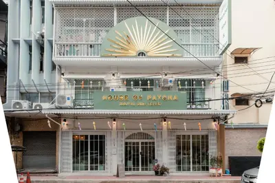 a building with a sign for a house of phantasy at House of Patcha เรือลพัชชา Hostel share bathroom in Bangkok