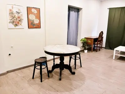a table in a room with a table and chairs at HD China Town MRT Dragon Temple กลางเยาวราช in Bangkok