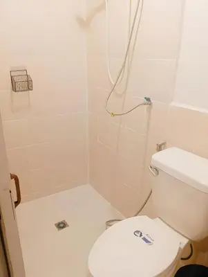 a bathroom with a toilet and a shower at xx Rest Inn Yaowarat เรสอินน์ เยาวราช in Samphanthawong