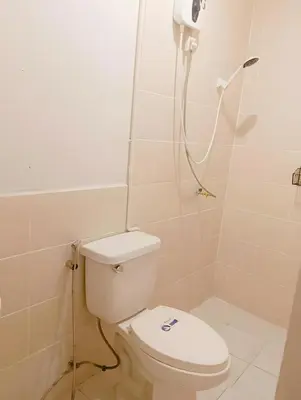 a bathroom with a toilet and a shower at xx Rest Inn Yaowarat เรสอินน์ เยาวราช in Samphanthawong