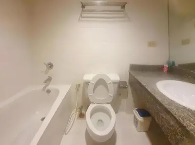 a bathroom with a toilet and a tub and a sink at XX Wish Inn Chidlom - วิช อินน์ ชิดลม in Bangkok