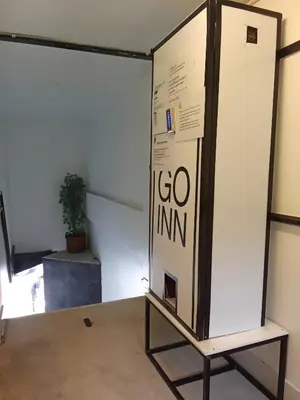 a display case in a room with a go infinity sign at XX Wish Inn Chidlom - วิช อินน์ ชิดลม in Bangkok