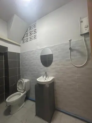 a bathroom with a toilet and a sink and a shower at Capricorn hostel Yaowarat in Chinatown