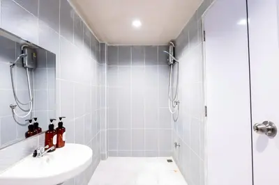 a bathroom with a shower and a sink at xx Stay On Sukhumvit Soi 11 สเตย์ออน สุขุมวิท 11 in Makkasan