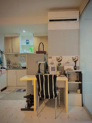 a kitchen with a table and a desk with a chair at Modern Condo with Full Amenities Bangkok in Sathani Ban Hua Mak