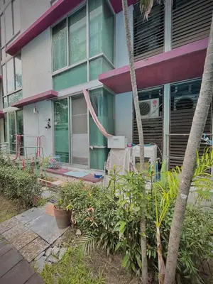 a house with a front yard with plants in front of it at Modern Condo with Full Amenities Bangkok in Sathani Ban Hua Mak