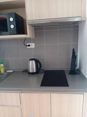 a kitchen with a tea kettle on the counter at Home hugs in Bangna
