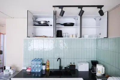 a kitchen with a sink and a counter top at Cozy 2BR Near Impact Arena, LTAT- WiFi Washer near DMK at C2 in Ban Song Hong