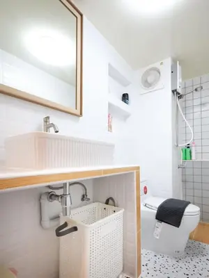 a white bathroom with a sink and a toilet at Cozy 2BR Near Impact Arena, LTAT- WiFi Washer near DMK at C2 in Ban Song Hong