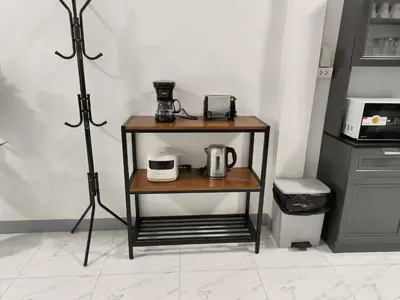 a small table with a coffee maker on it at Charoen Nakhon 48 House in Godown