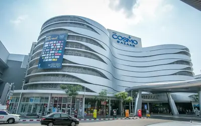 a car is parked in front of a building at Cozy 2BR for 4 persons, Impact,Wi-Fi & Washer, DMK in Bangkok