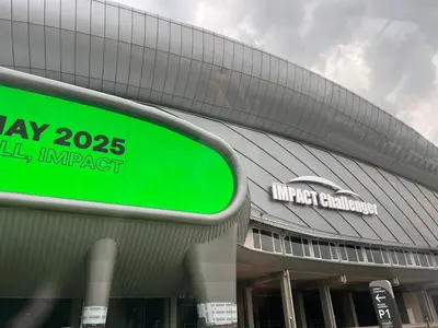 a building with a green sign in front of it at Cozy 2BR for 4 persons, Impact,Wi-Fi & Washer, DMK in Bangkok