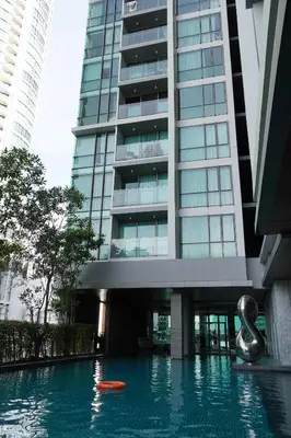 a building with a swimming pool in front of a building at Luxury room close to BTS in Bangkok