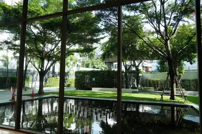 a view of the courtyard from the window of a building at Luxury room close to BTS in Bangkok
