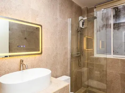 a bathroom with a sink and a shower at 2 Bedroom for 4 guests Private in center of Sathorn in Bangkok