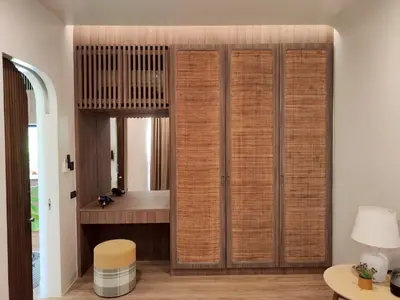 a bathroom with a wicker closet with a tub at Chobjai Hostelry - Chaw Cher Home at Bang Kra Jao in Bang Krasop