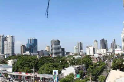 a view of a city skyline with tall buildings at Bangkok Place Apartment - EKAMAI BTS in Bangkok