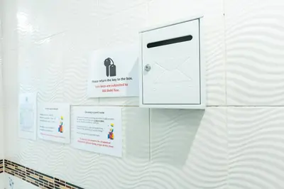 a white wall with a mail box on it at xxThe Hidden Giant Swing เดอะ ฮิดเด้น เสาชิงช้า in Bangkok