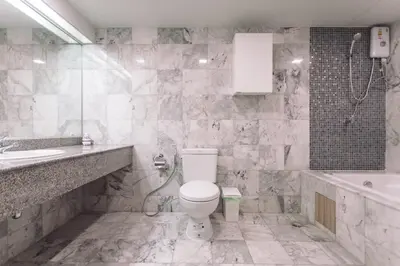 a bathroom with a toilet and a sink and a tub at NEW Bangkok centre-2 bedrooms Netflix 31 floor in Bangkok