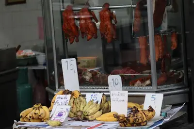 a bunch of bananas on a table with signs at Lumphini 7 Townhouse Master Authentic BKK Comfort in Bangkok