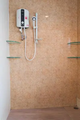 a bathroom with a shower with a phone on the wall at Cloud no 5 Generous space Green n Quiet Heart BKK in Bangkok