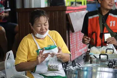 a woman with a bandage on her face eating food at SKY 6 The Perfect Quiet Oasis BKK Center Near MRT in Bangkok