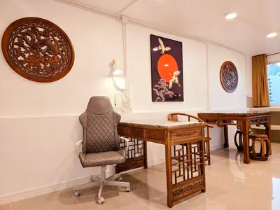 a home office with a desk and a chair at Crane nest 14 loft with views over Sathorn in Bangkok