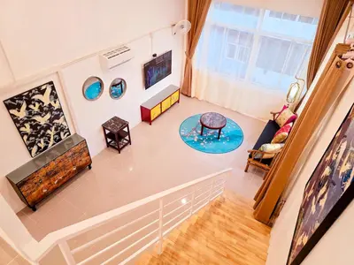 an overhead view of a living room with a couch at Crane nest 14 loft with views over Sathorn in Bangkok
