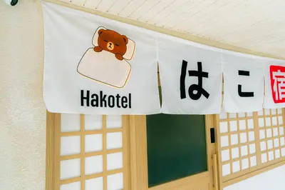 a banner on a classroom door with a bear on it at Hakotel in Bang Rak