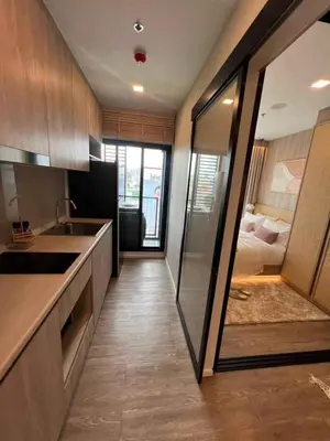 a kitchen with a sink and a counter top at Modiz Modiza Sukhumvit R5 in Bangkok