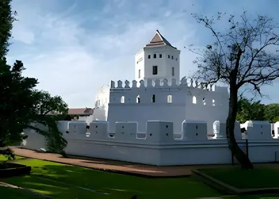 a white building with a tower on top of it at xx Mitr Inn Khaosan มิตร อินน์ ตรอกข้าวสาร in Bangkok