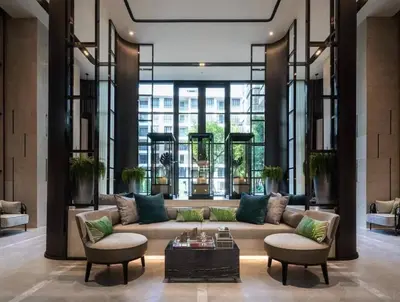 a living room with a couch and two chairs at Luxury condominium Heart of BKK Ekkamai in Bangkok