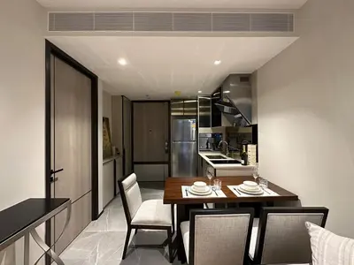 a kitchen and dining room with a table and chairs at Luxury condominium Heart of BKK Ekkamai in Bangkok