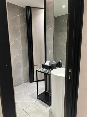 a bathroom with a sink and a mirror at Luxury condominium Heart of BKK Ekkamai in Bangkok