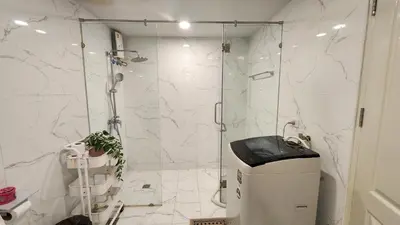 a bathroom with a shower with a glass door at Floating Above Bangkok Same buiding of Lebua High Floor Dream near Iconsiam Asiatique in Bangkok