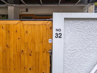 a wooden gate with a sign that says no on it at Studio room with private garden in Center Sathorn in Bangkok