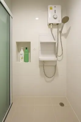 a bathroom with a shower with a toilet and a sink at 1 Bedroom Bangkok Skyline View Apartment At ON-NUT in Bangkok