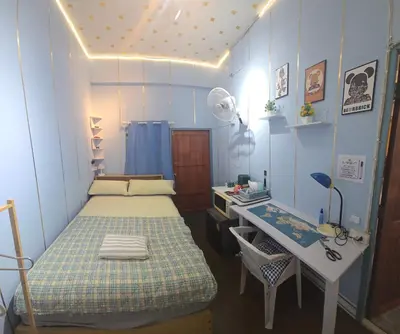 a small room with a bed and a desk at 100 Luxury Studio Apartment with private balcony in Bangkok