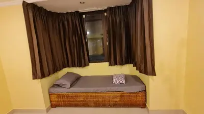 a small bed in a room with a window at Comfort 1BR 2 King Beds, Best Value Stay, near Bts Nana in Bangkok