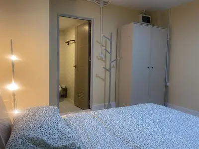 a bedroom with a bed and a closet and a mirror at 1 Bed Nr IKEA 15Mins to Airport in Bangkok