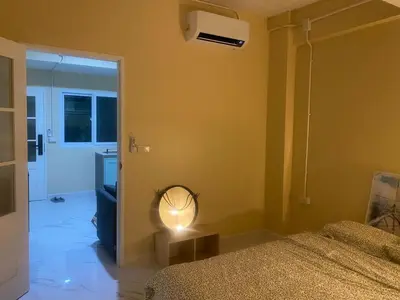 a bedroom with a bed and a fan in a room at 1 Bed Nr IKEA 15Mins to Airport in Bangkok