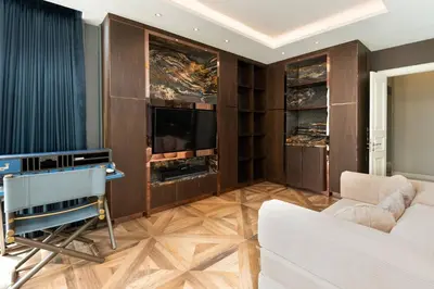 a living room with a couch and a tv at Modern Luxury Poolhaus with Lift in Khlong Toei
