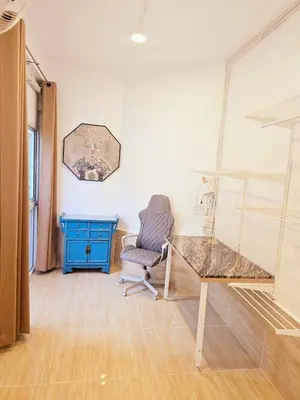 a room with a desk and a chair and a table at Crane nest 6 Townhouse View in Bangkok