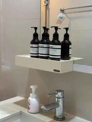a shelf above a sink with four bottles on it at New 5 STARS suite l 4 mins walk BTS&APL in Bangkok