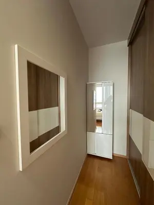 a room with a mirror and a painting on the wall at New 5 STARS suite l 4 mins walk BTS&APL in Bangkok