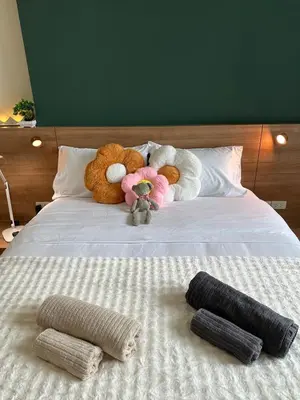 a group of stuffed animals sitting on a bed at New 5 STARS suite l 4 mins walk BTS&APL in Bangkok