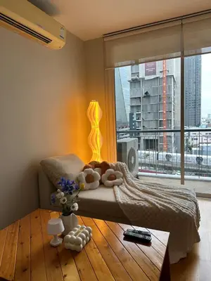 a bedroom with a bed and a large window at New 5 STARS suite l 4 mins walk BTS&APL in Bangkok