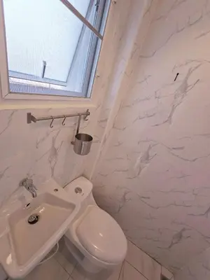 a bathroom with a toilet and a sink at Crane nest 8 townhouses view middle with balcony in Bangkok